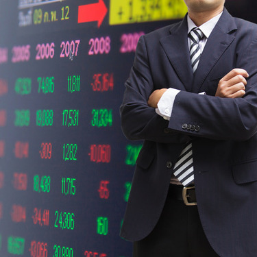 Image of Business Man and Stock Numbers Image of Business Man and Stock Numbers