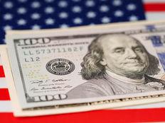 Dollar%20banknotes%20on%20usa%20america%20flag%20background